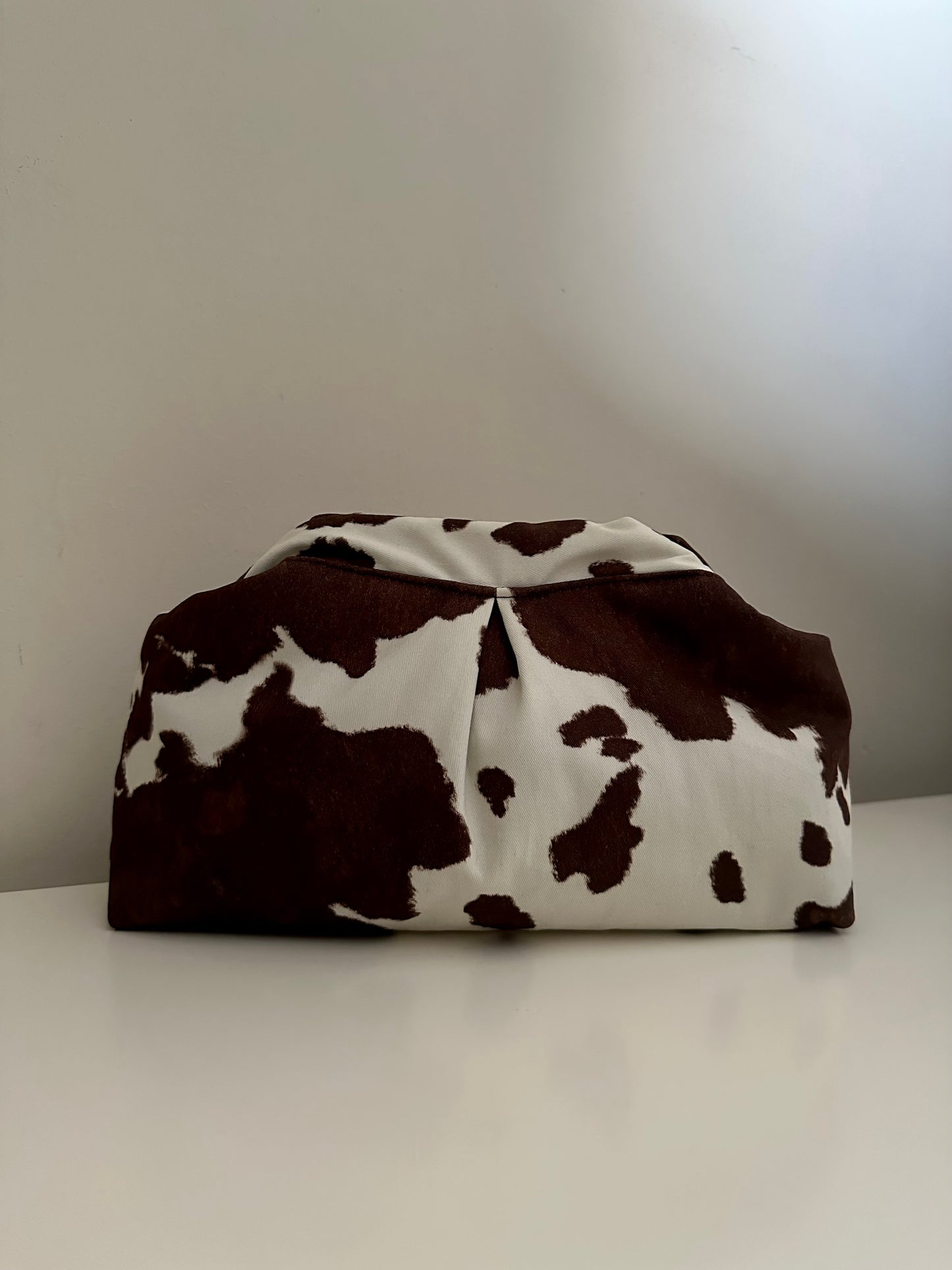 Cow print clutch