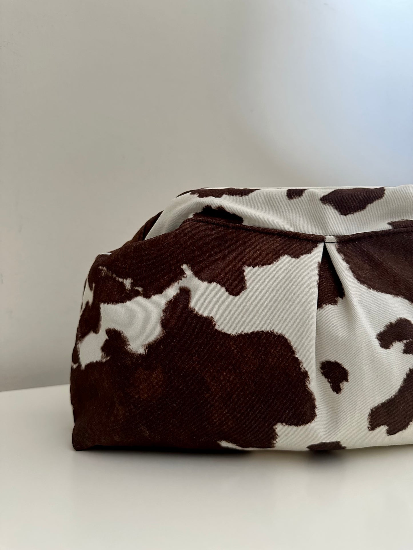 Cow print clutch